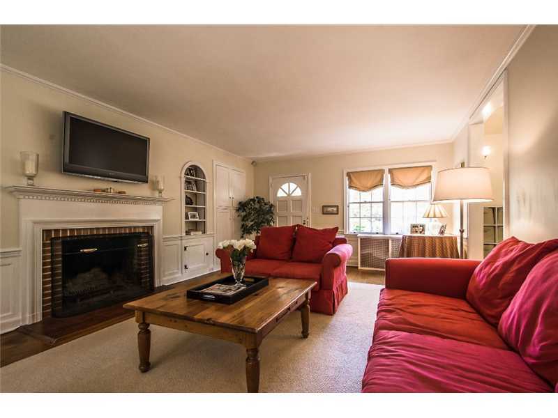 167 West Norwalk Road Norwalk, CT 06850 - Photo 7 of 24 a living room with furniture a fireplace and a flat screen tv