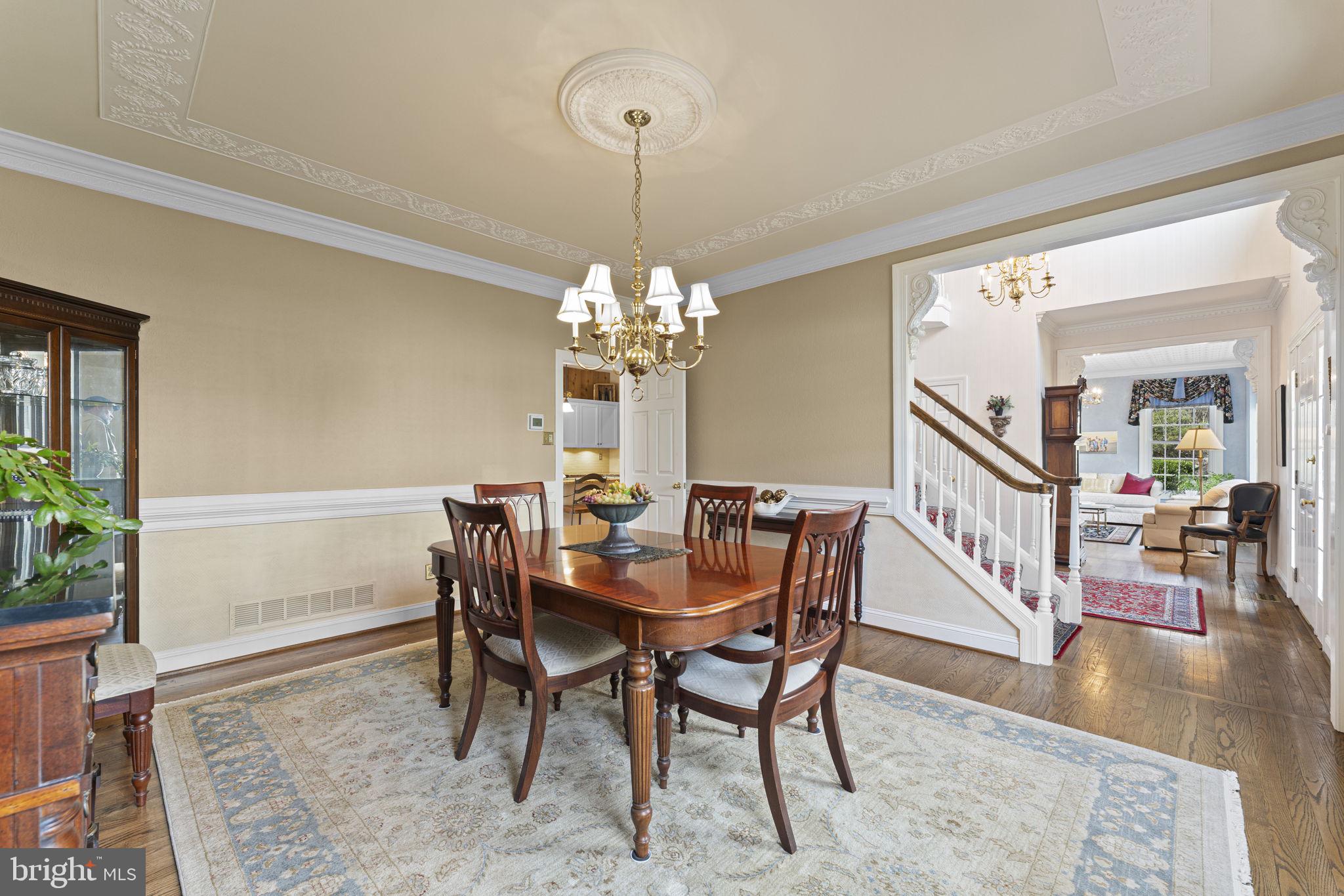 103 Carters Grove, Unit A3 Malvern, PA 19355 - Photo 13 of 41 a view of a dining room with furniture a rug and wooden floor