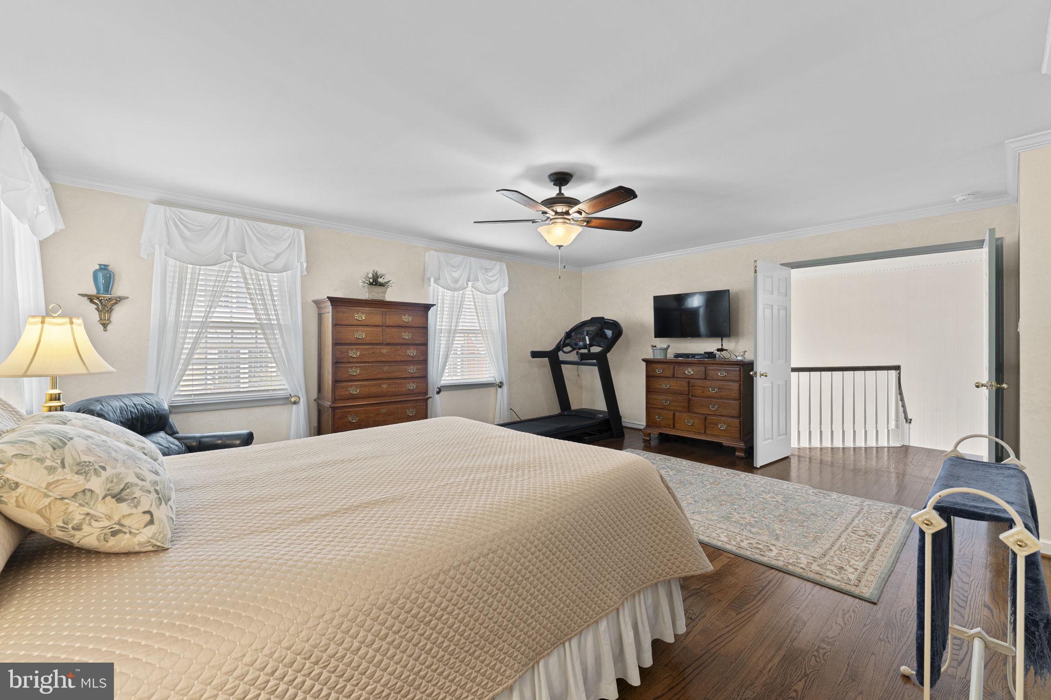 103 Carters Grove, Unit A3 Malvern, PA 19355 - Photo 28 of 41 a bedroom with a bed and a chandelier