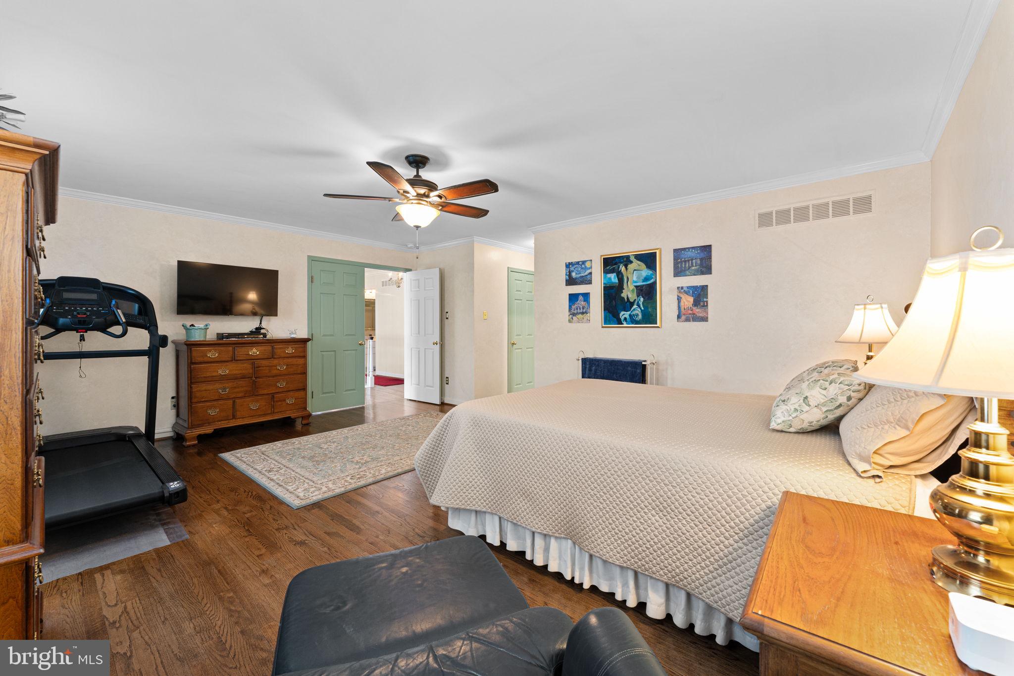 103 Carters Grove, Unit A3 Malvern, PA 19355 - Photo 29 of 41 a bedroom with a bed and wooden floor