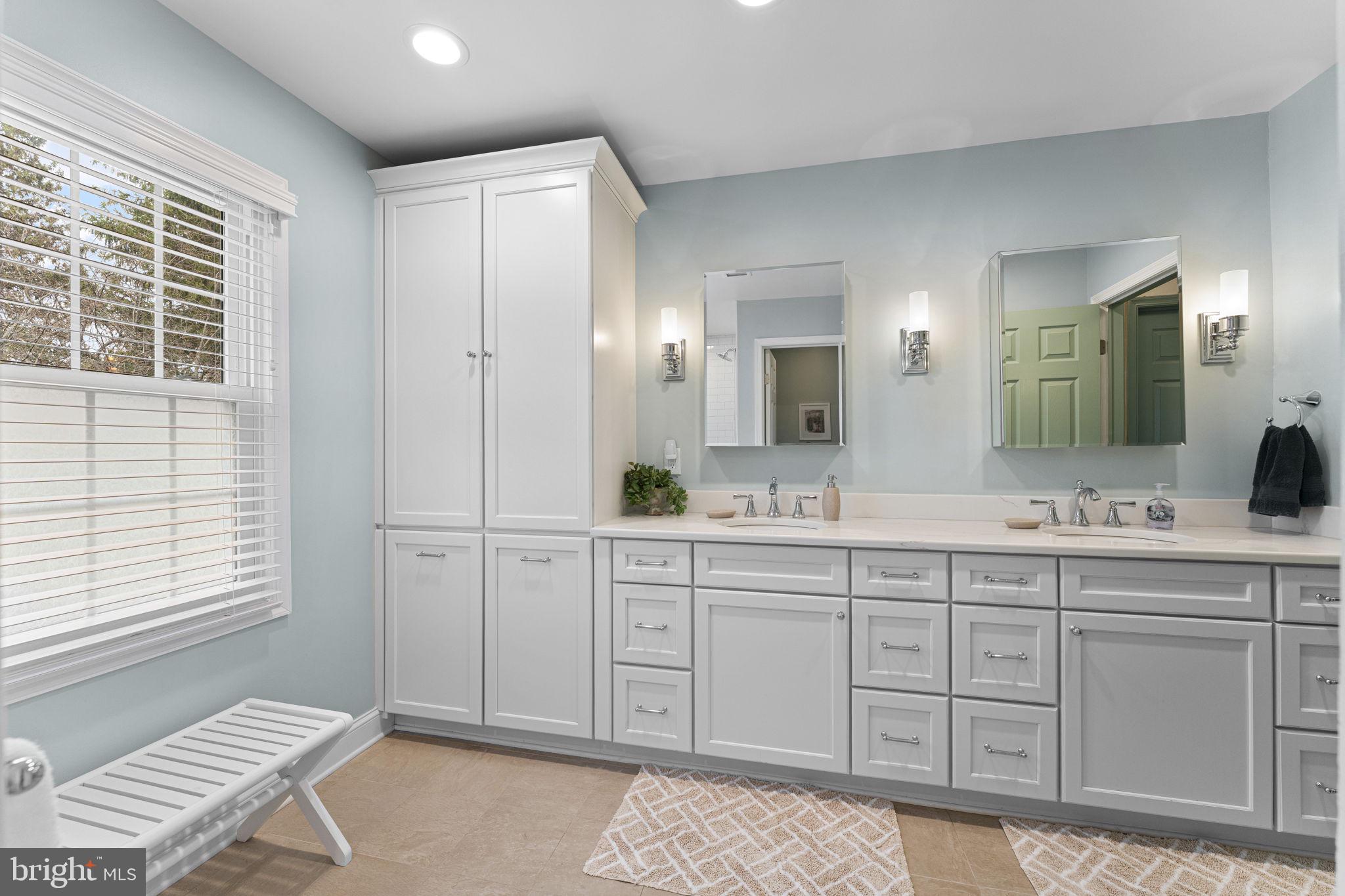 103 Carters Grove, Unit A3 Malvern, PA 19355 - Photo 30 of 41 a spacious bathroom with a shower a sink and a mirror