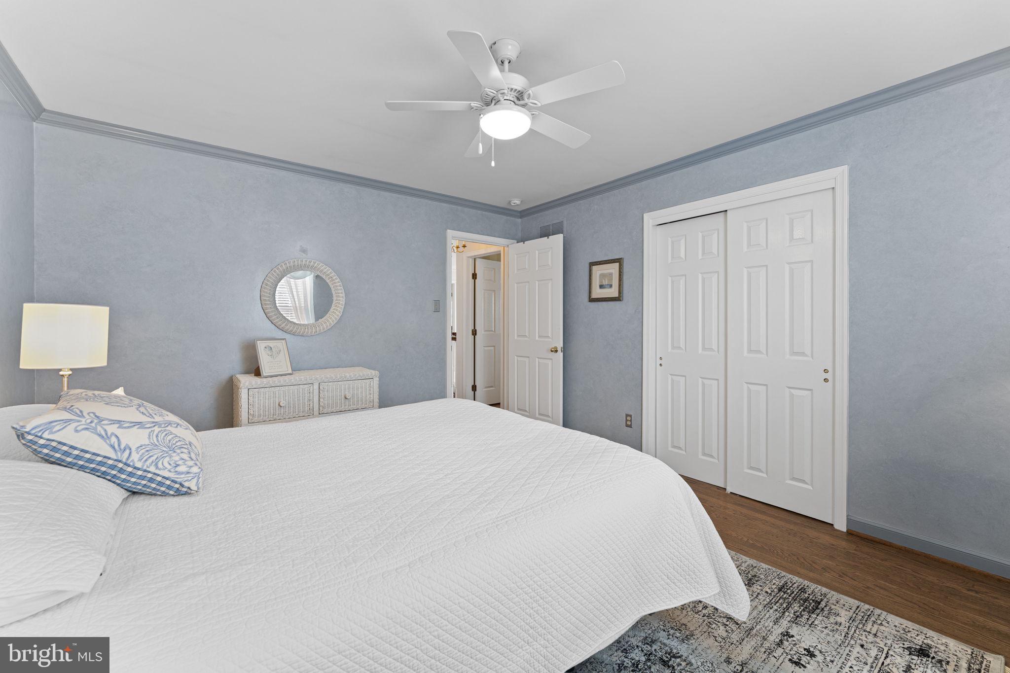 103 Carters Grove, Unit A3 Malvern, PA 19355 - Photo 33 of 41 a bedroom with a large bed and a chandelier