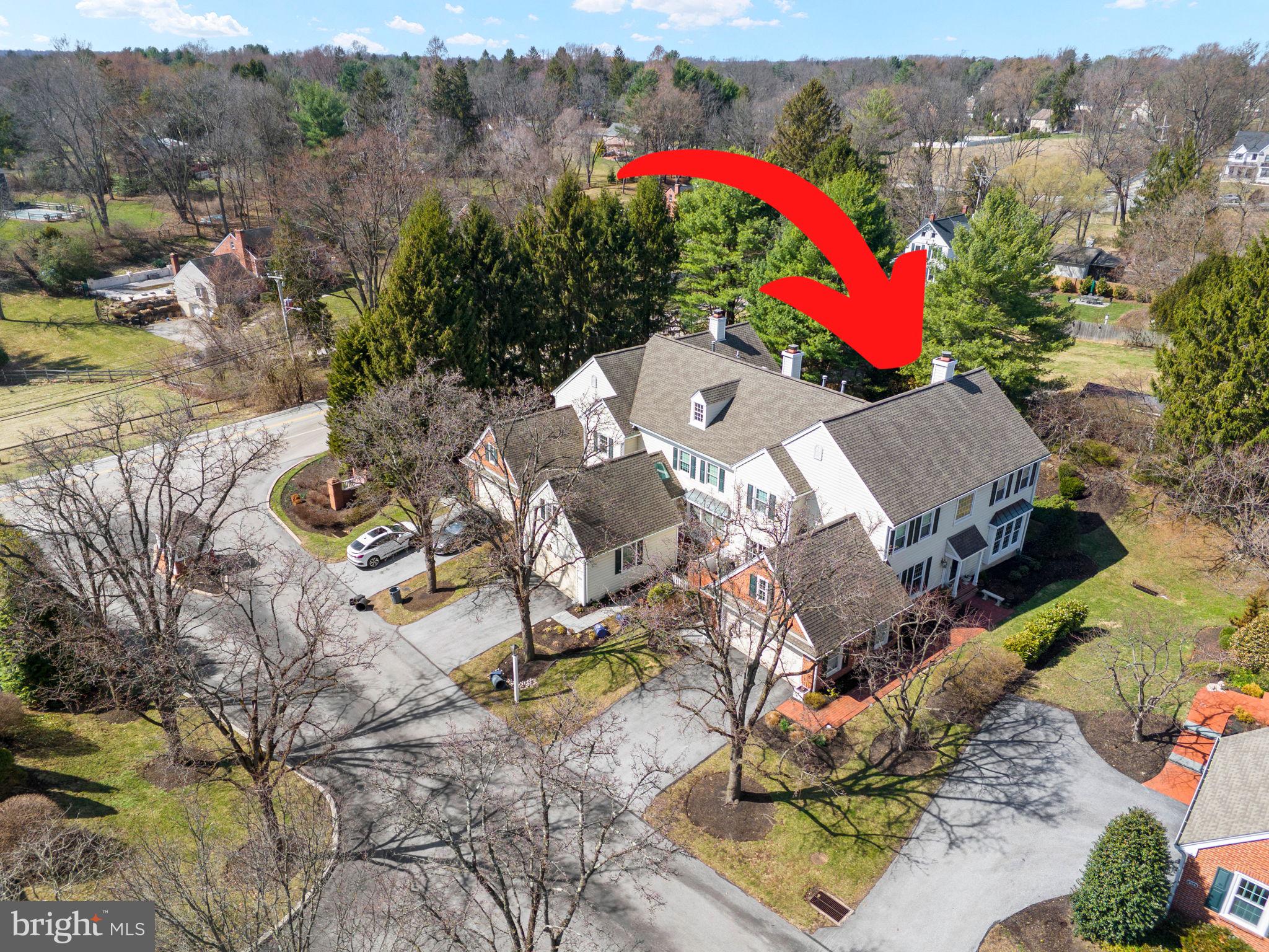 103 Carters Grove, Unit A3 Malvern, PA 19355 - Photo 5 of 41 an aerial view of a house with a yard and mountain