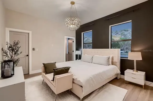 a bedroom with a bed and a couch