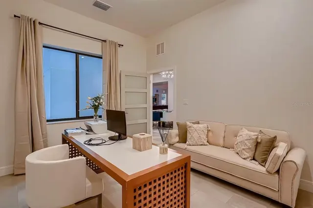 a living room with furniture and a table