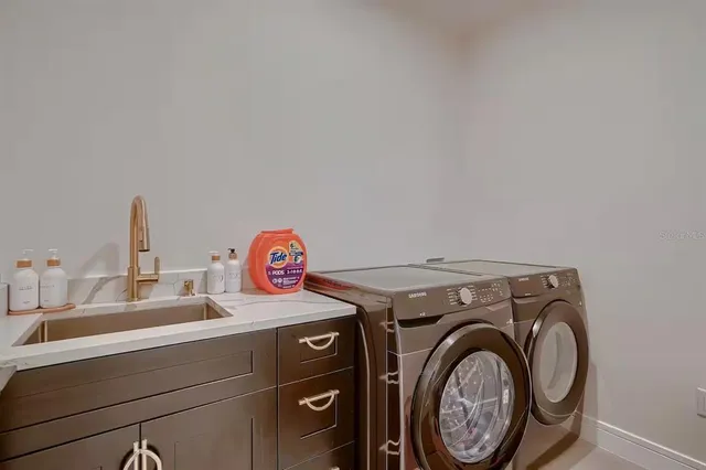 a utility room with dryer and washer