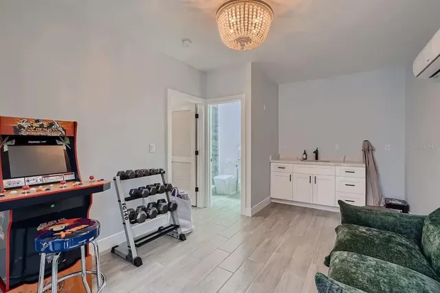 a bedroom with furniture and a window