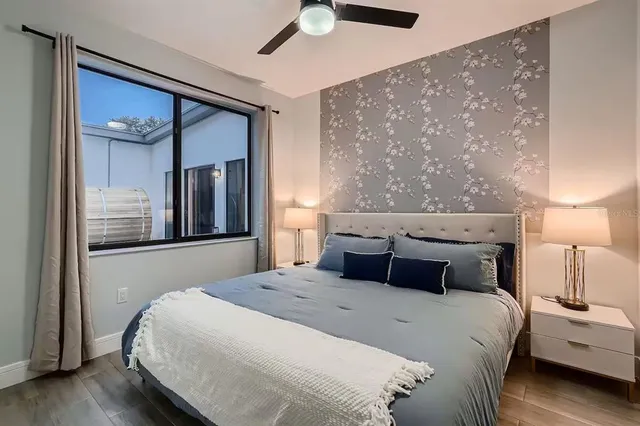 a bedroom with bed and window