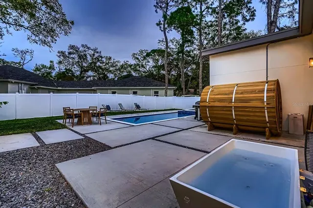 a view of backyard and entertaining space