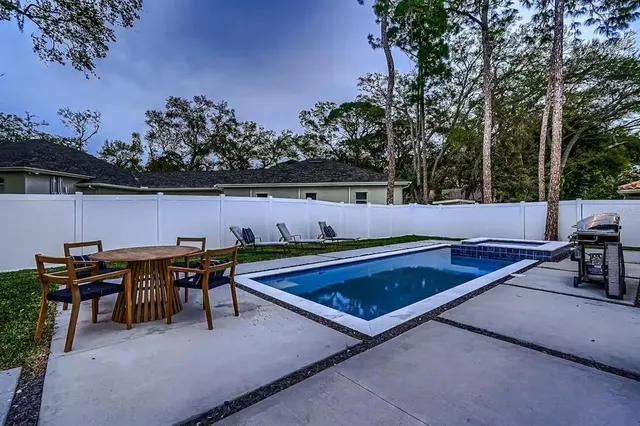 an outdoor sitting space with furniture