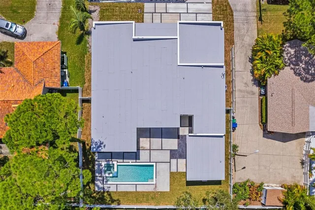 an aerial view of residential houses with outdoor space