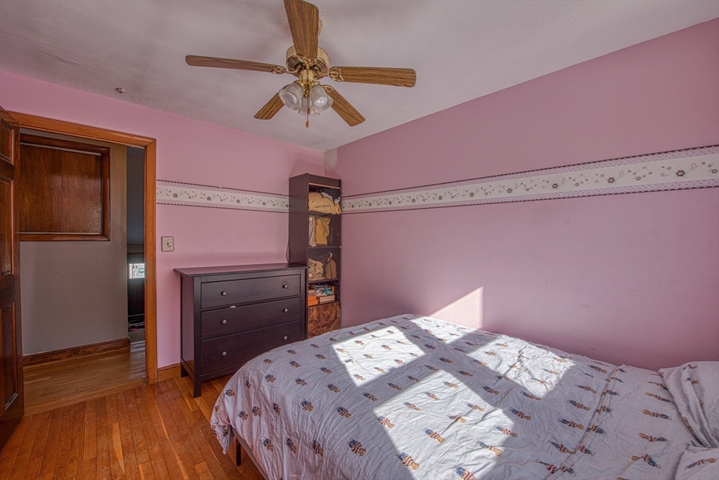 12 Brewster Road Randolph, MA 02368 - Photo 15 of 27 a bedroom with a bed and a dresser