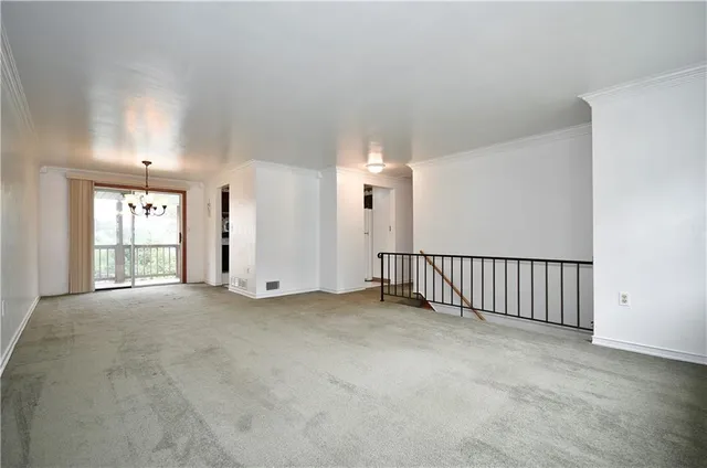 a kitchen with a sink window and cabinets