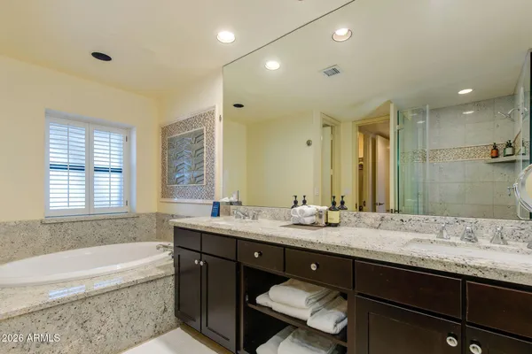 a kitchen with stainless steel appliances granite countertop a refrigerator and a stove