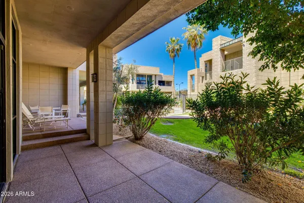 a outdoor dining space with furniture and outdoor view