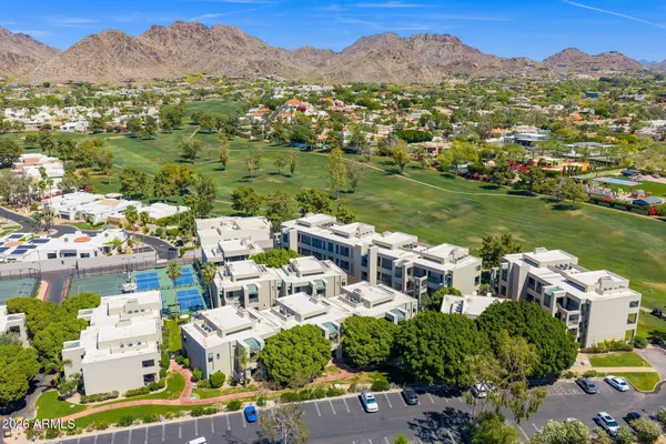 a house view with a sitting space and garden