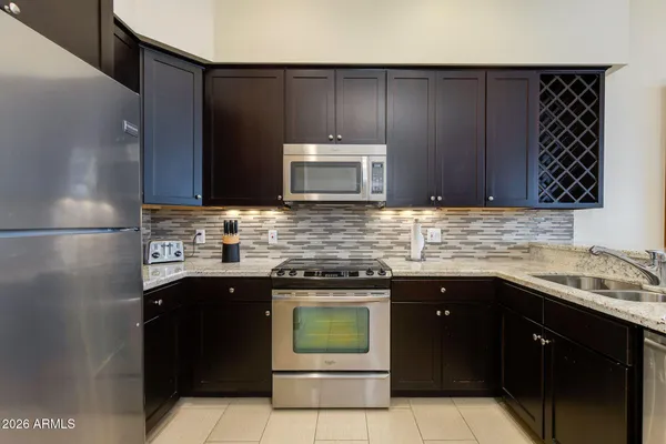 a living room with fireplace furniture and a flat screen tv