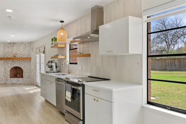 a kitchen with a sink and cabinets
