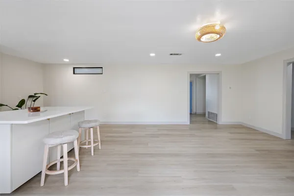 a view of a livingroom with furniture and wooden floor