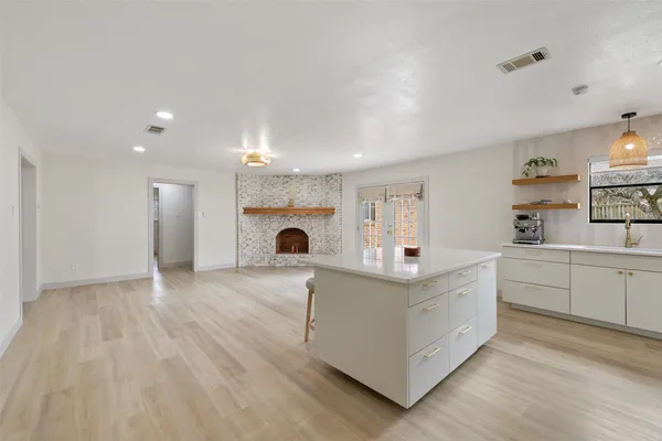 a view of kitchen with furniture and wooden floor