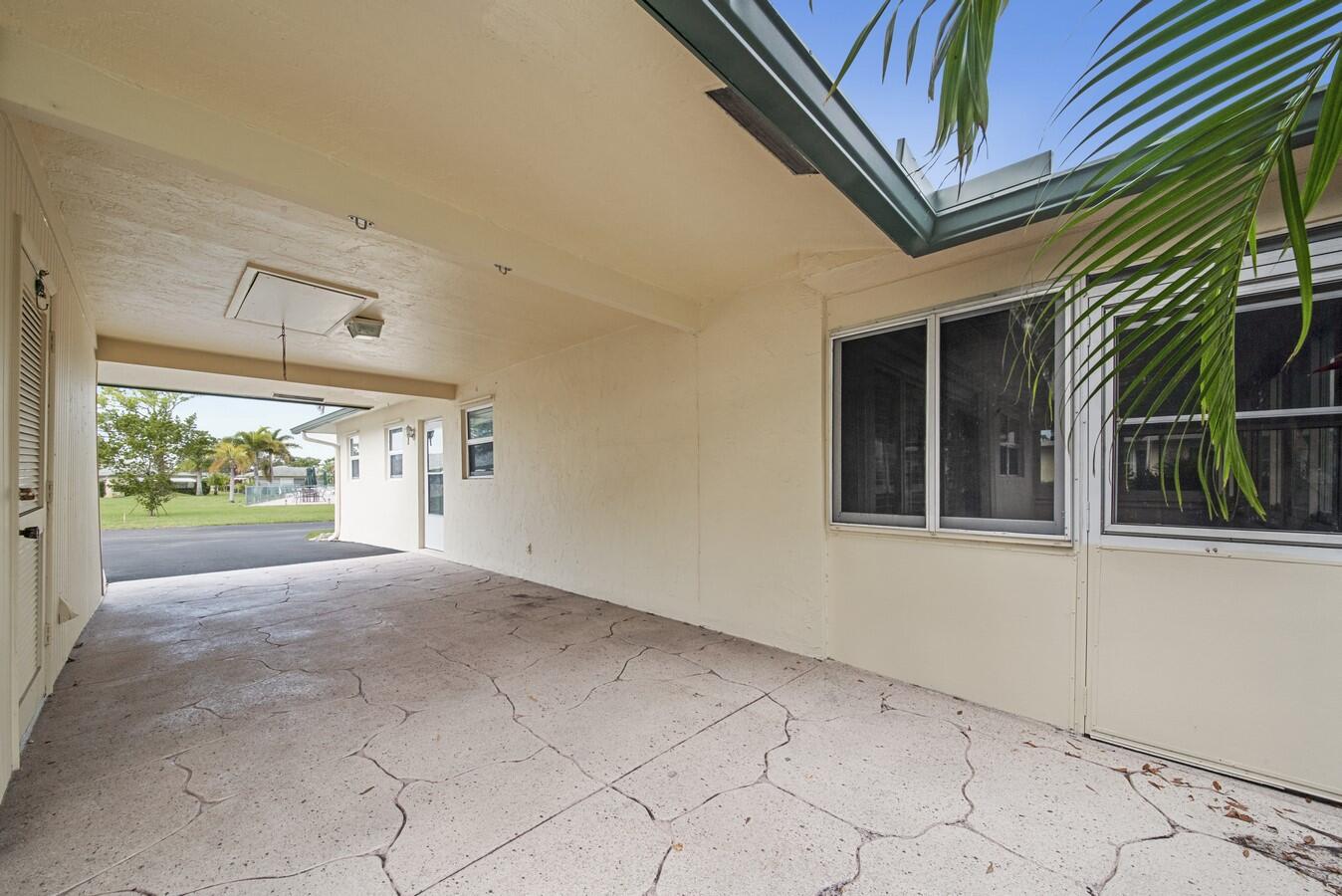 227 Cardinal Lane Delray Beach, FL 33445 - Photo 21 of 33 Carport