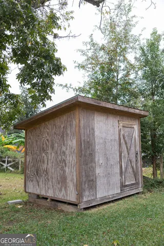 a view of backyard with tub and trees