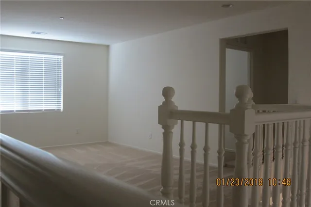 a view of hallway with a window