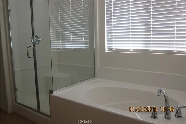 a bath tub sitting next to a window