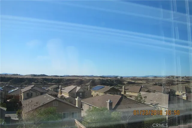 an aerial view of residential building and ocean view