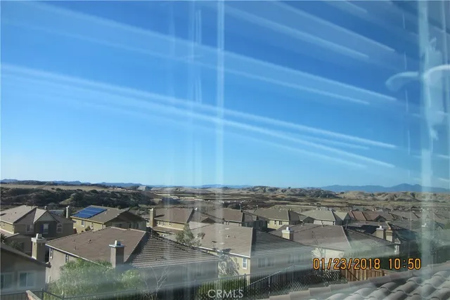 an aerial view of a building with a ocean view