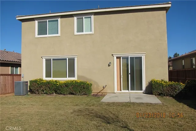 a house view with a backyard space
