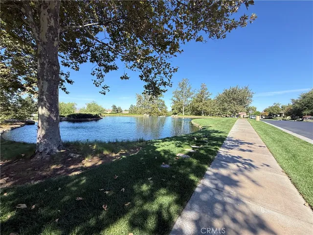 a view of a street with a yard
