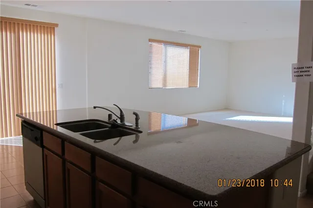 a kitchen with a sink and a window