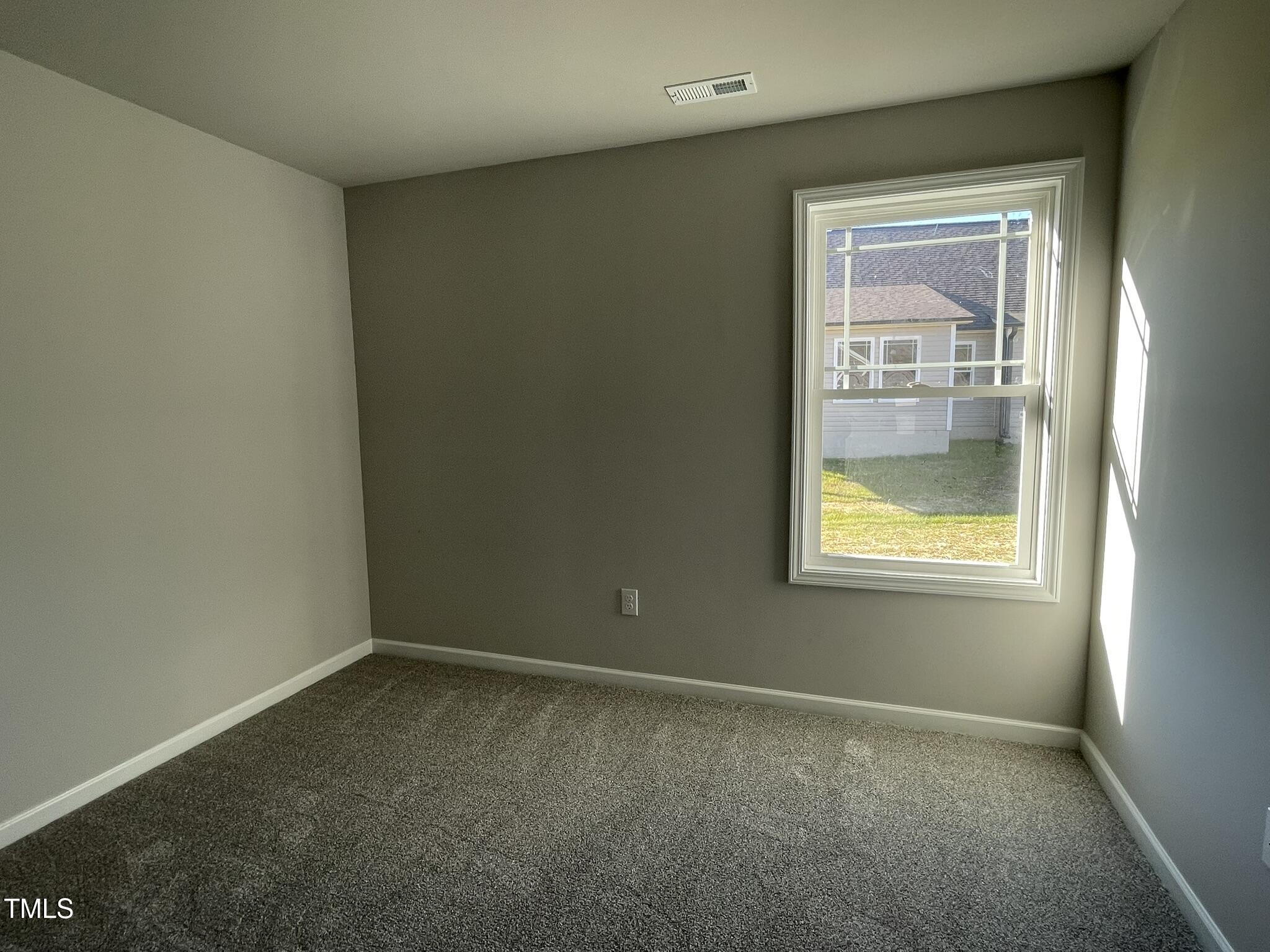 42 Heatherglenn Circle Princeton, NC 27569 - Photo 13 of 15 an empty room with a window