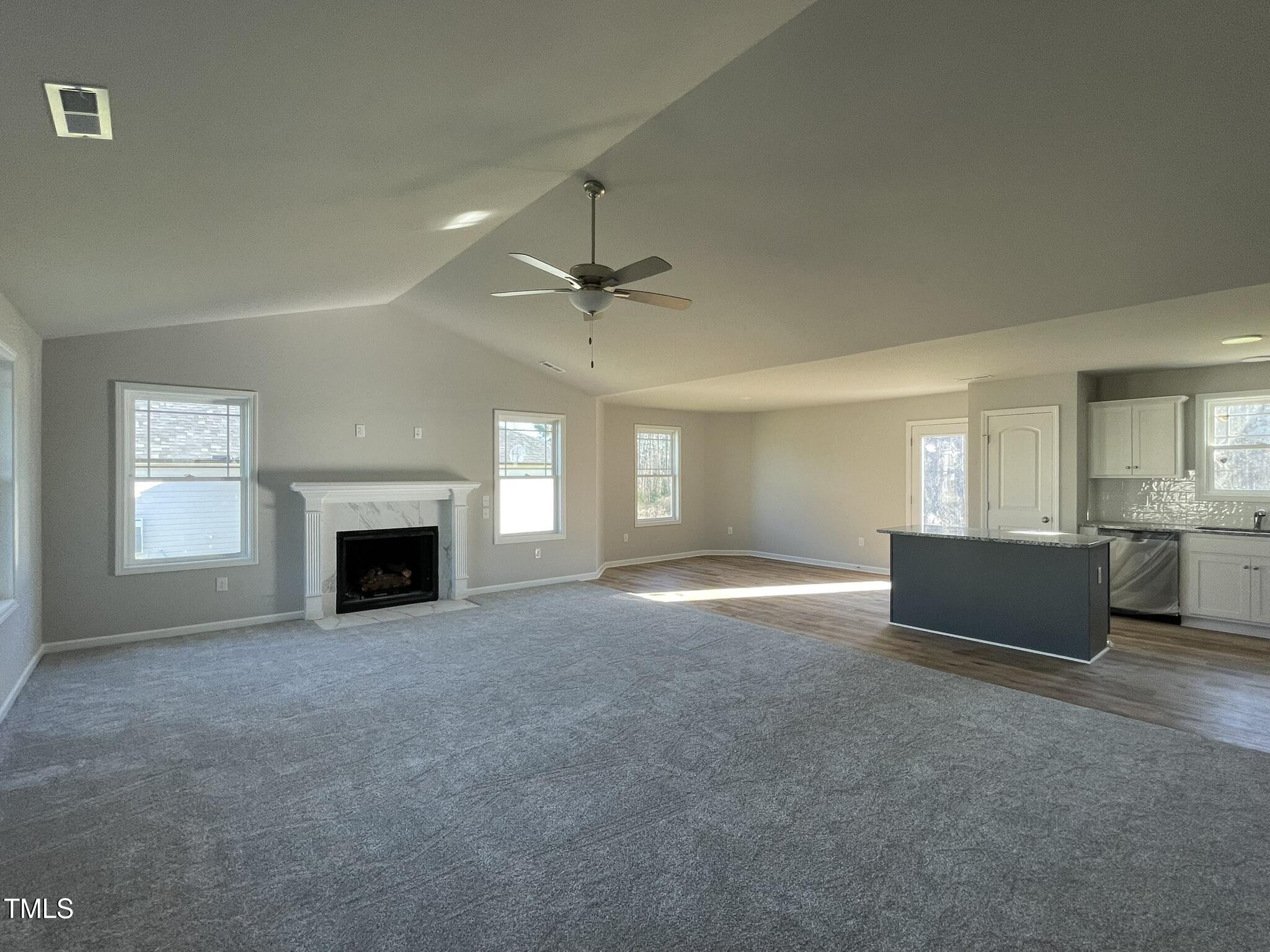 42 Heatherglenn Circle Princeton, NC 27569 - Photo 2 of 15 an empty room with fireplace and windows