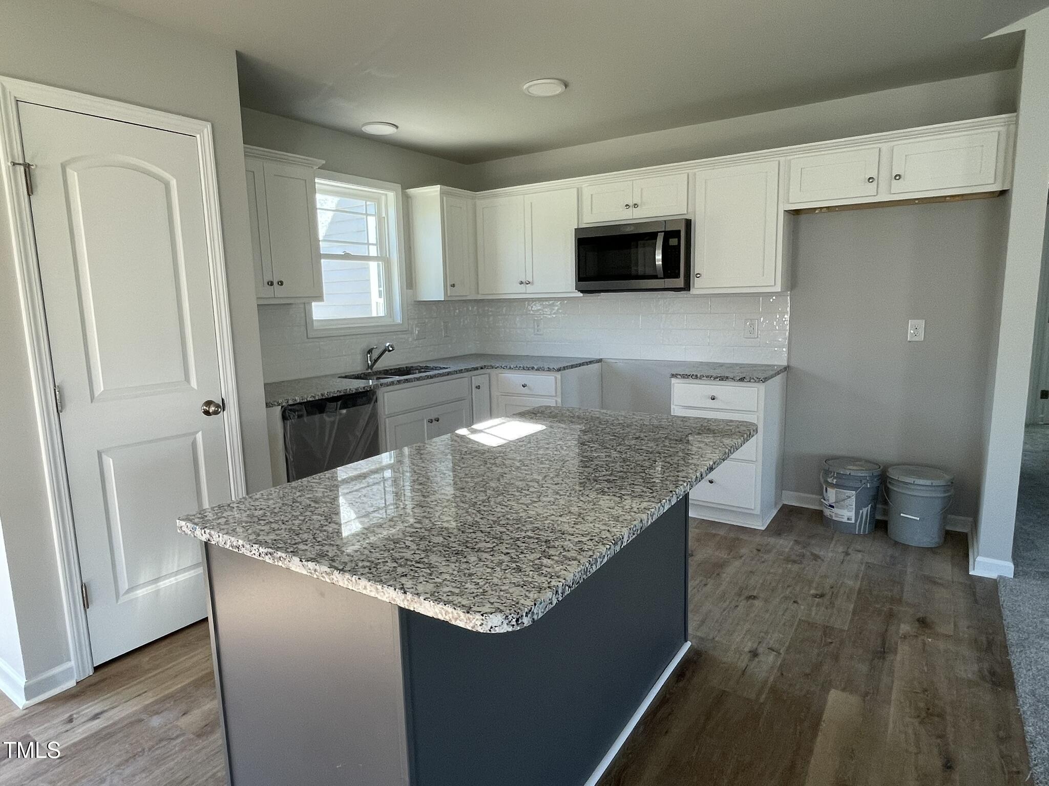 42 Heatherglenn Circle Princeton, NC 27569 - Photo 3 of 15 a kitchen with stainless steel appliances granite countertop a sink stove and refrigerator