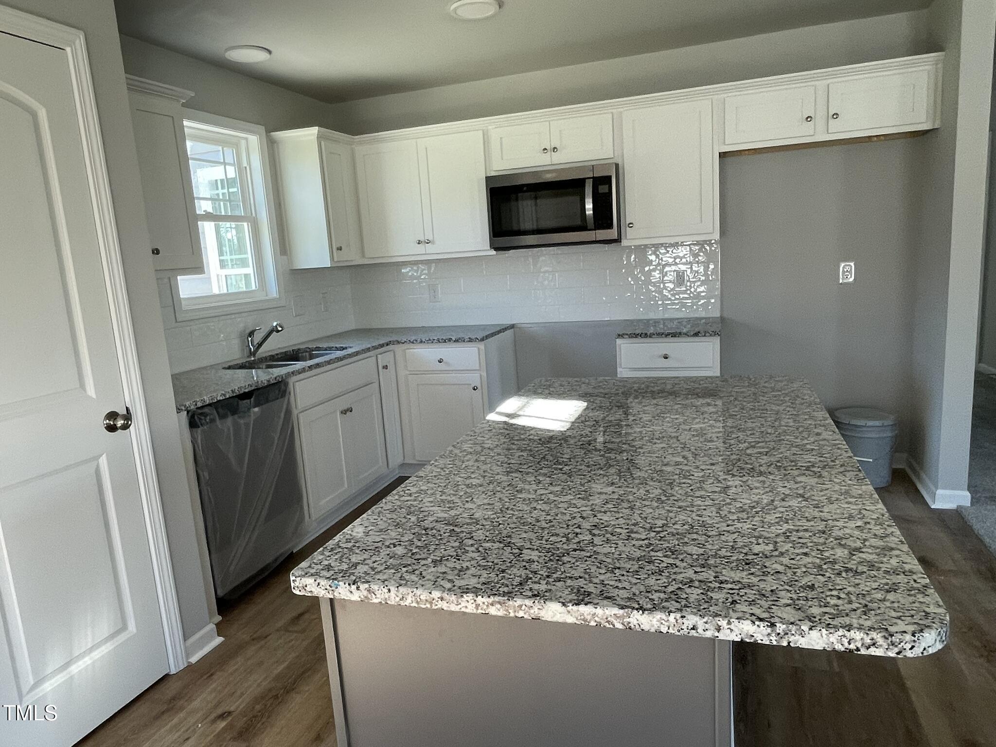 42 Heatherglenn Circle Princeton, NC 27569 - Photo 5 of 15 a kitchen with sink stove and microwave