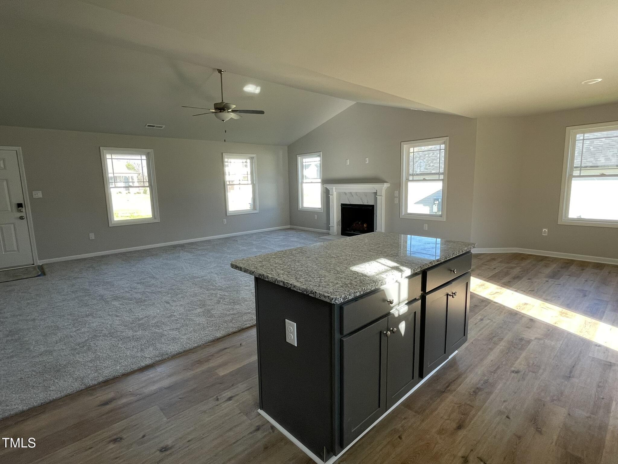 42 Heatherglenn Circle Princeton, NC 27569 - Photo 6 of 15 an open kitchen with granite countertop sink and stove top oven