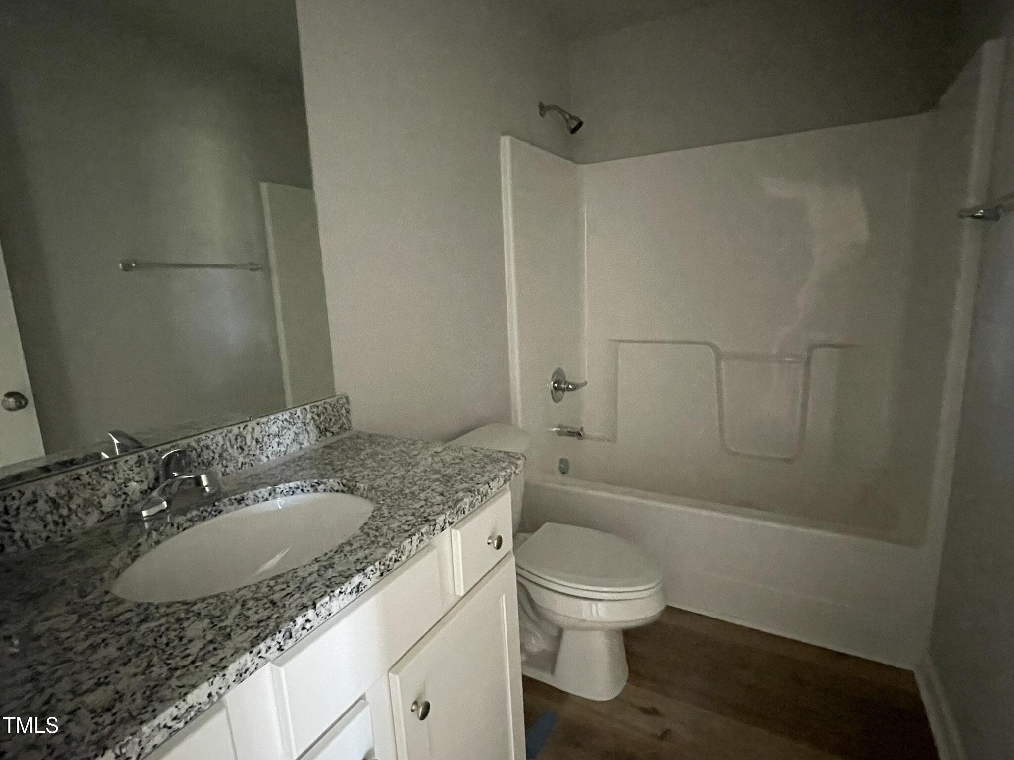 42 Heatherglenn Circle Princeton, NC 27569 - Photo 7 of 15 a bathroom with a granite countertop sink toilet and shower