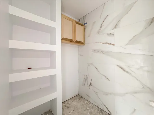 a bathroom with a bathtub and shower