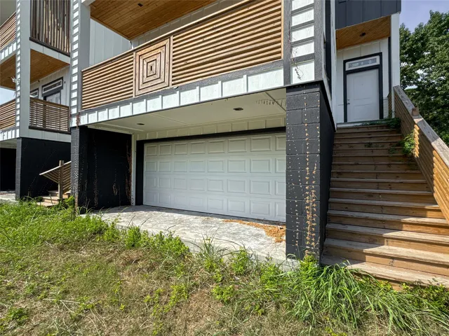 a view of backyard with garage