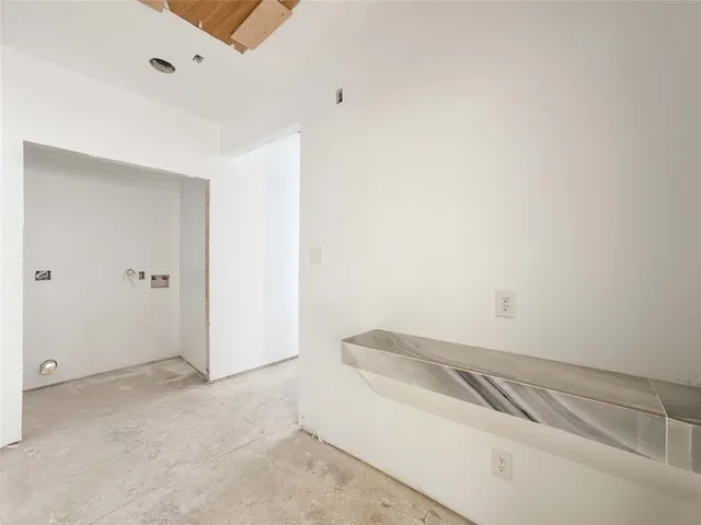 a view of a field with trees in the background