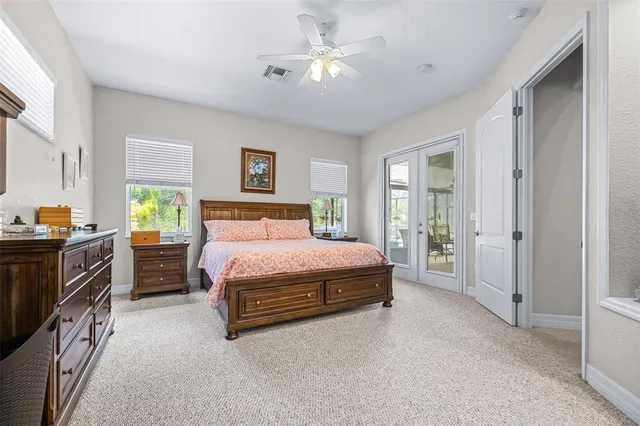 a bedroom with a bed and a television