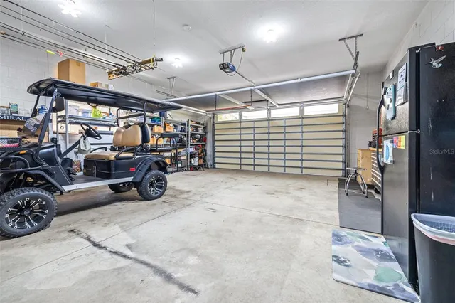 an aerial view of a house with a yard and lake view