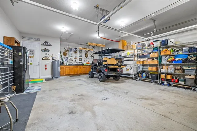 an aerial view of a house with outdoor space and lake view