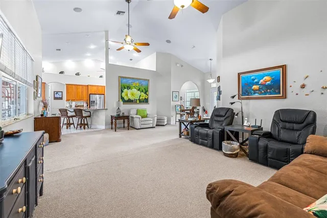a kitchen with stainless steel appliances granite countertop a stove sink and cabinets