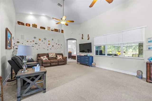 a kitchen with stainless steel appliances granite countertop a stove top oven a sink dishwasher and white cabinets