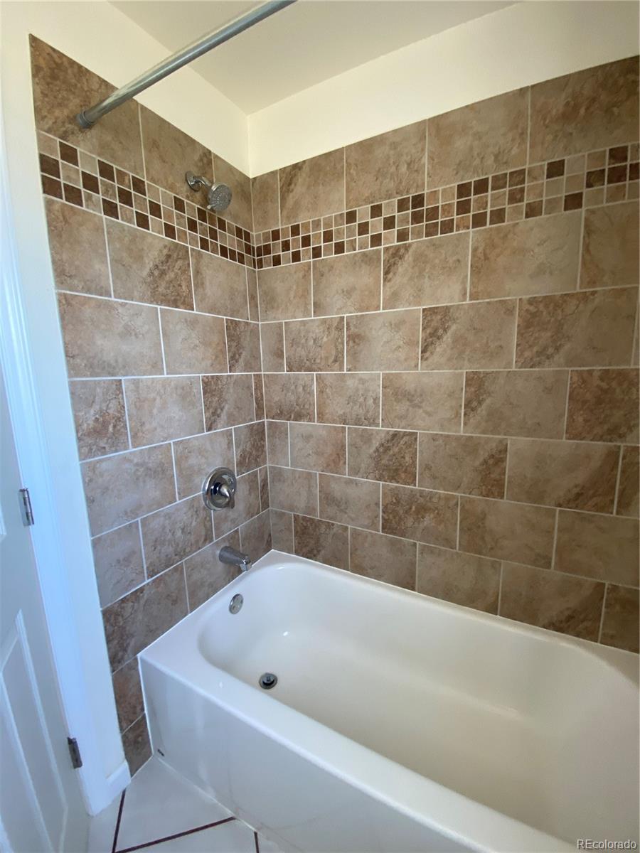 613 Lake Street Rangely, CO 81648 - Photo 11 of 12 a bathroom with a bathtub