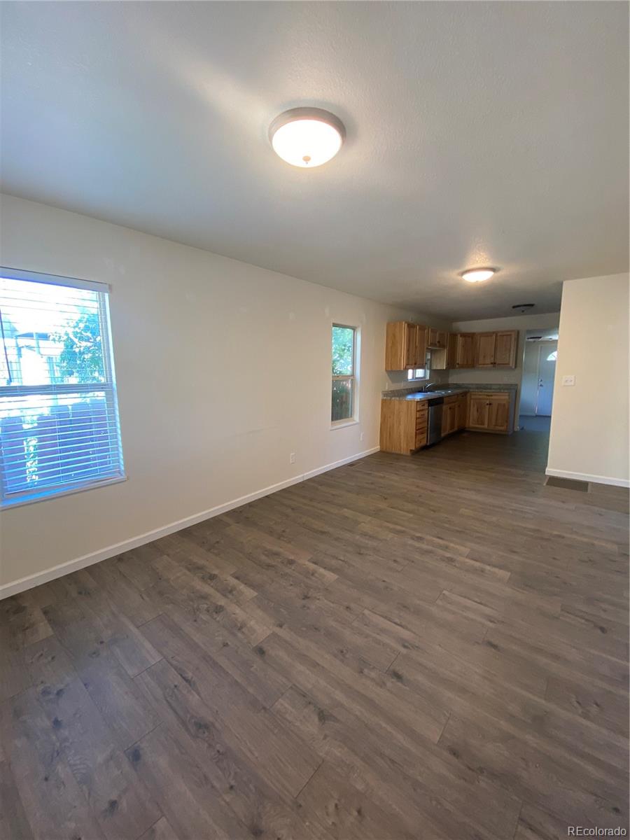 613 Lake Street Rangely, CO 81648 - Photo 2 of 12 a view of an empty room with a window