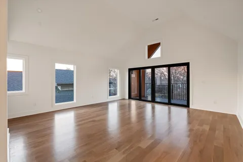 a view of a balcony with wooden floor